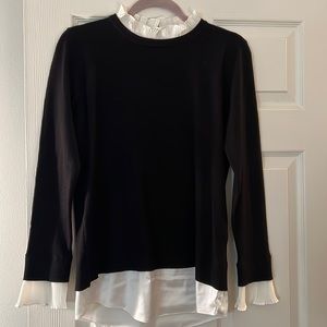 Classy black sweater with silk ruffle details